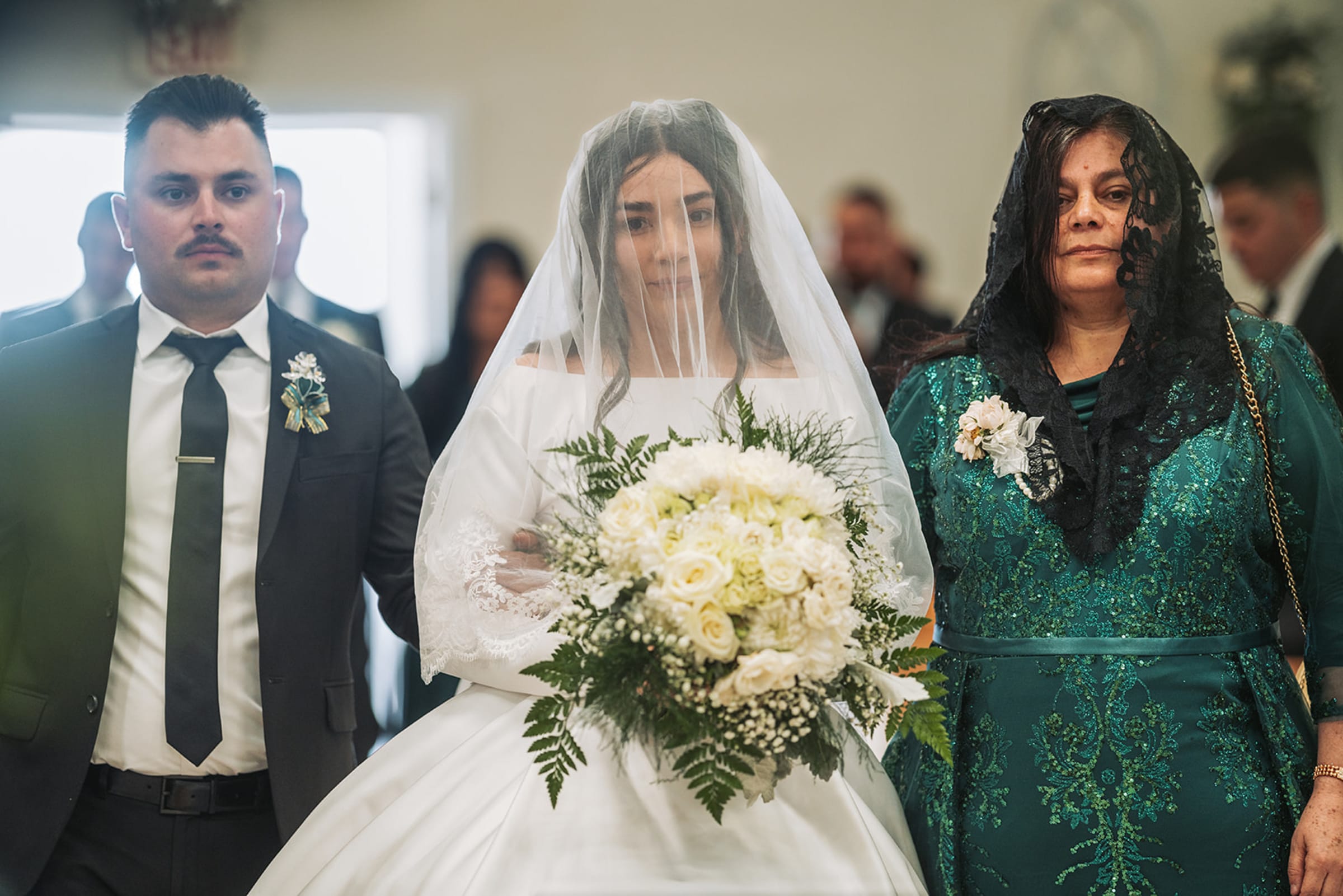 Intimate vow exchange with banded cliff formations and dramatic desert sky at Ghost Ranch — Casey Addason Photography