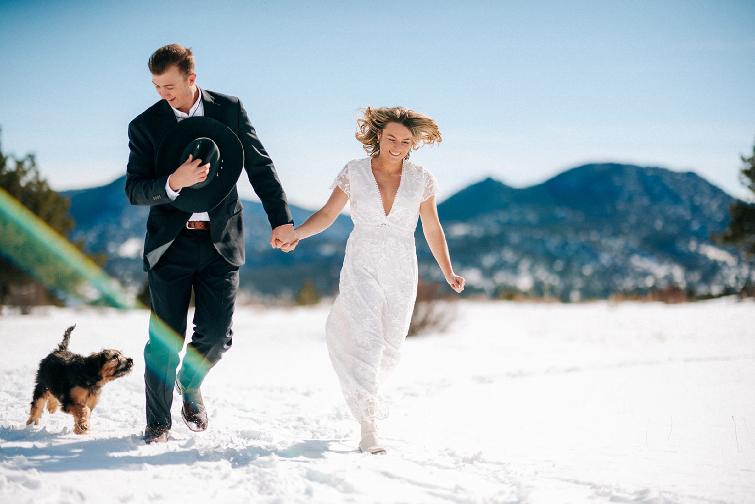 Sunset engagement photo with Sangre de Cristo mountain panorama from La Fonda rooftop in Santa Fe — Casey Addason Photography