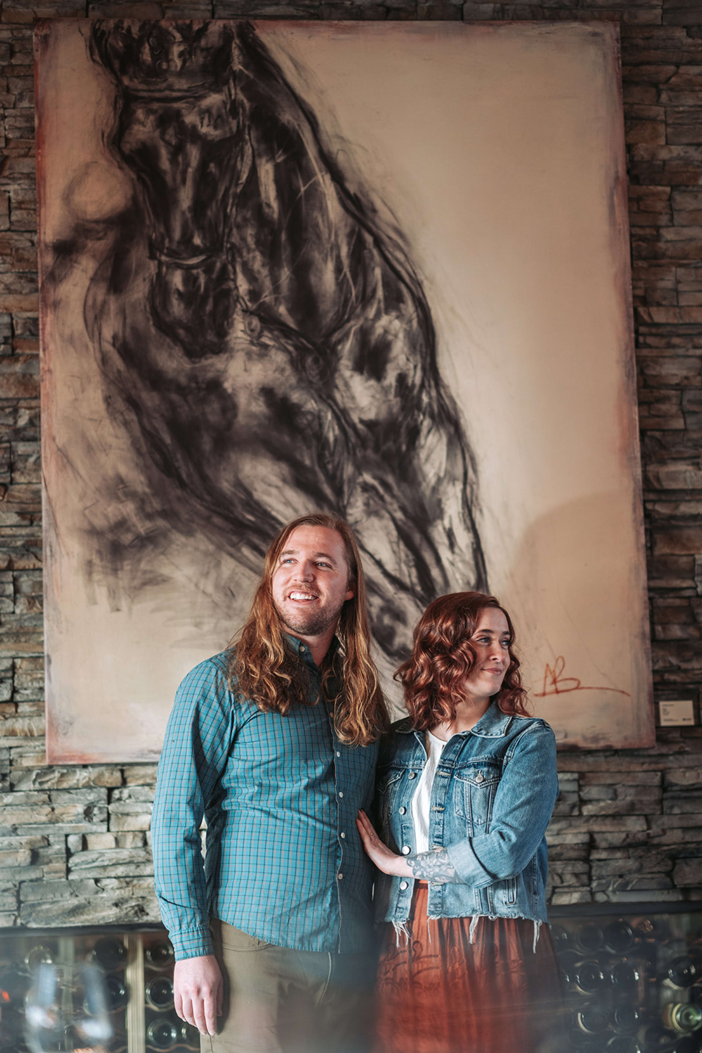 Documentary-style wedding portrait of couple walking through a Santa Fe courtyard after their ceremony — Casey Addason Photography