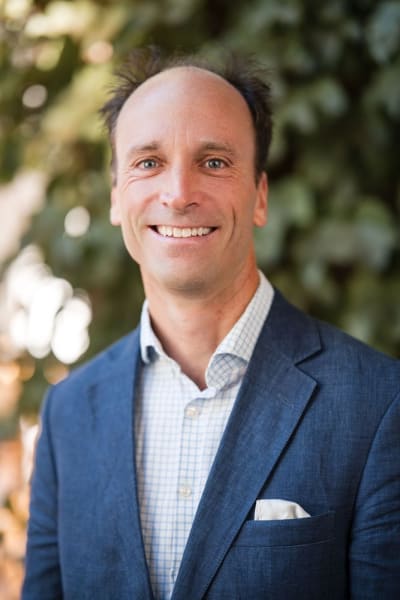 Founder headshot in natural light, blue blazer — Casey Addason Photography