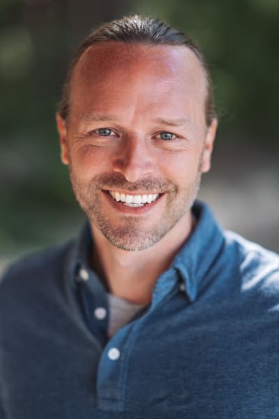 Natural light headshot at Bishop's Lodge, Santa Fe, deep blue shirt — Casey Addason Photography