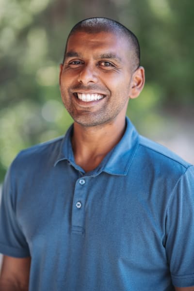 Natural light headshot at Bishop's Lodge, Santa Fe, slate blue polo — Casey Addason Photography