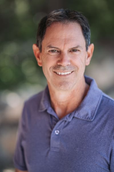 Natural light headshot at Bishop's Lodge, Santa Fe, plum polo — Casey Addason Photography