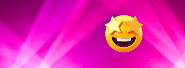 Hymyilevä emoji, jolla on tähdenmuotoiset silmät eloisalla vaaleanpunaisella taustalla, jossa on valonsäteitä.