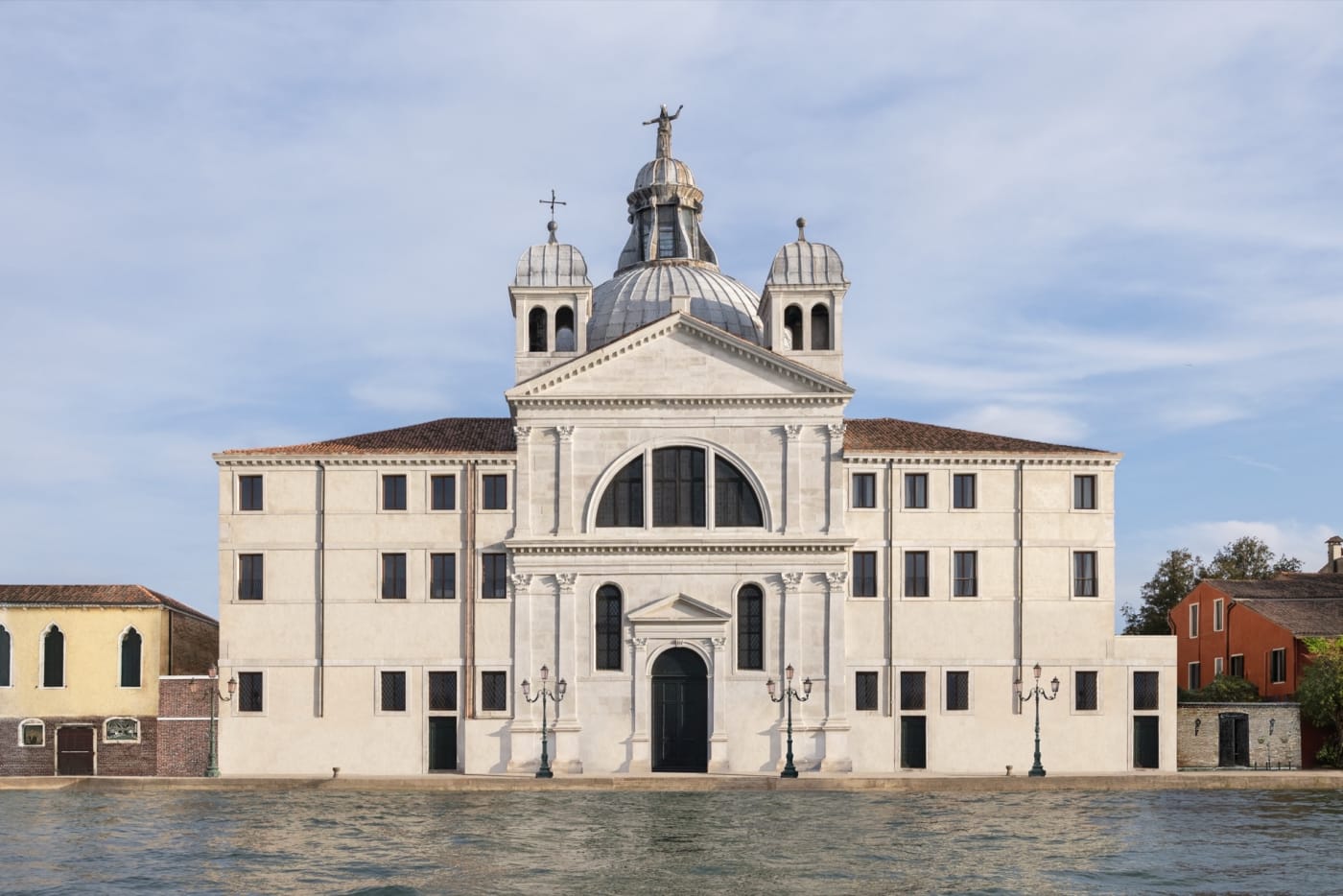 Facade of Airelles Palladio in Venice seen from the Giudecca Canal, Zitelle church and white stone domes