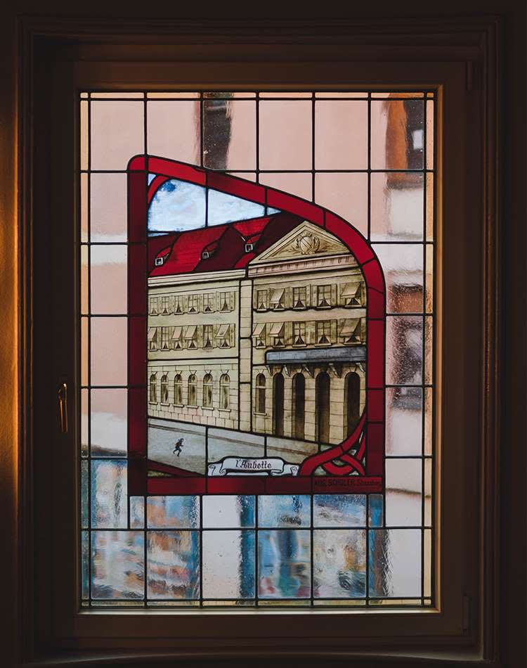 A stained glass window representing the former Maison Rouge palace of Strasbourg