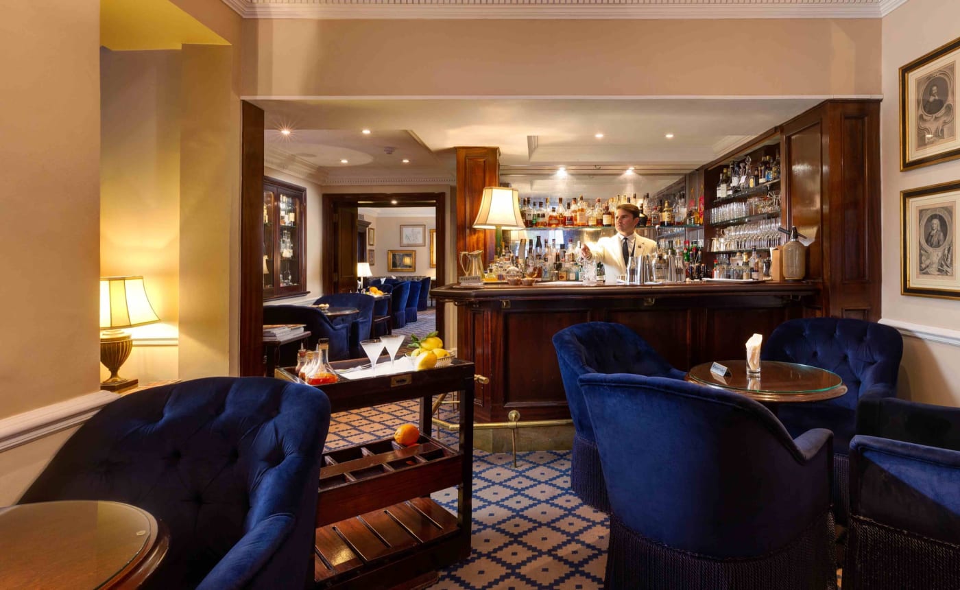 The room at Dukes Bar, blue velvet armchairs