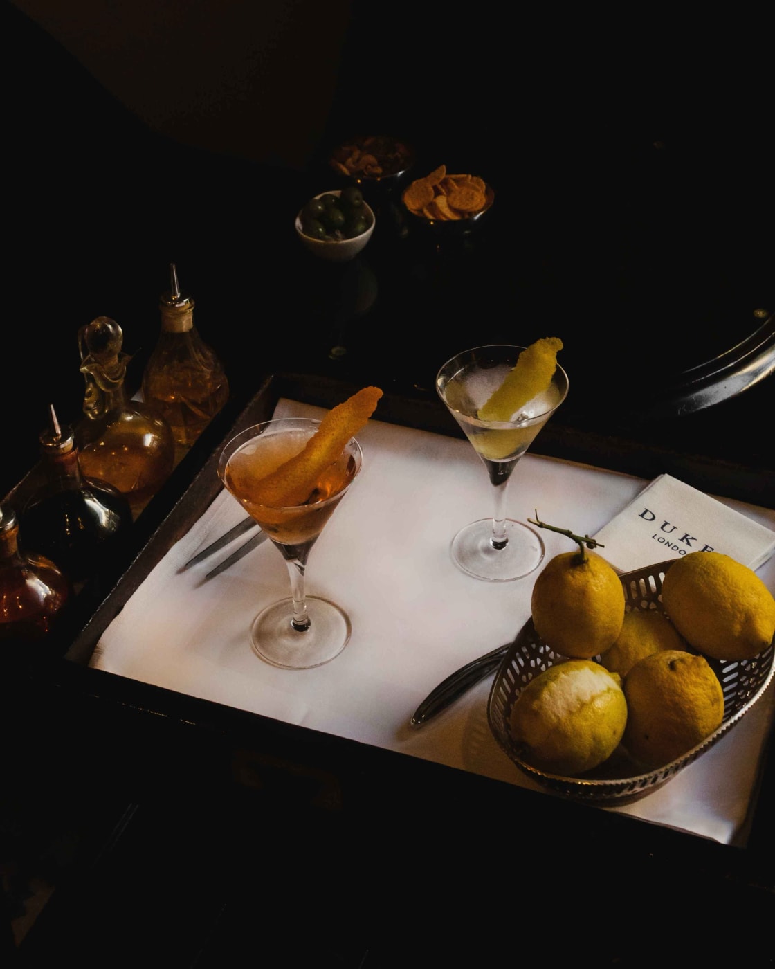 Two martinis from Dukes Bar in frosted glasses, lemon zest