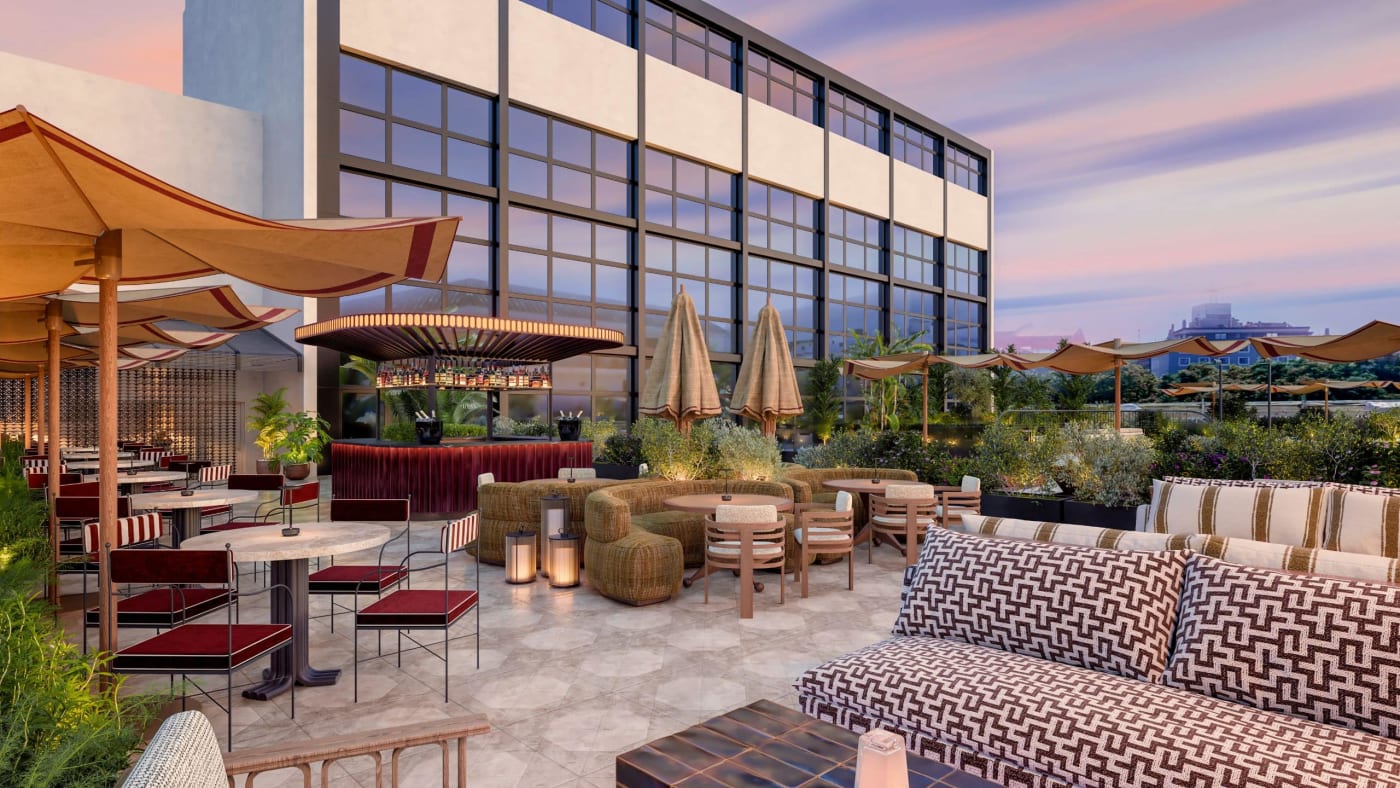 Rendering of the rooftop bar terrace, parasols and patterned banquettes