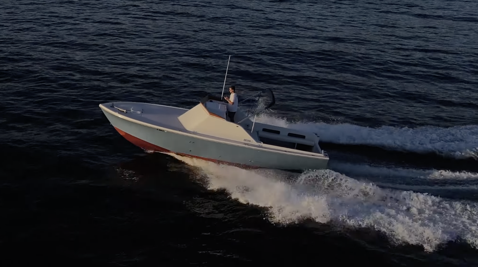 Aerial view of the Crystaliner 29.5 underway showing the deck layout and helm