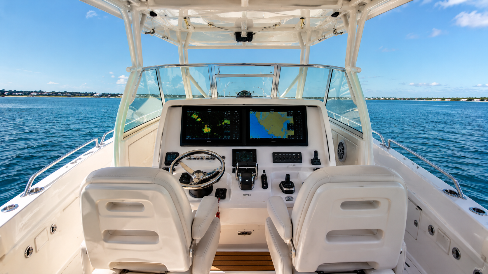 Rear cockpit and transom of the Grady-White Freedom 307 with livewell, rod holders and swim platform