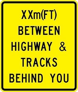Between Highway And Tracks Sign - W10-11b