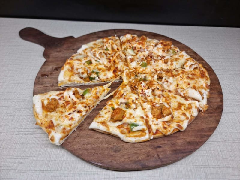 Double Burst chicken pizza at Black Bird Café, Vellore
