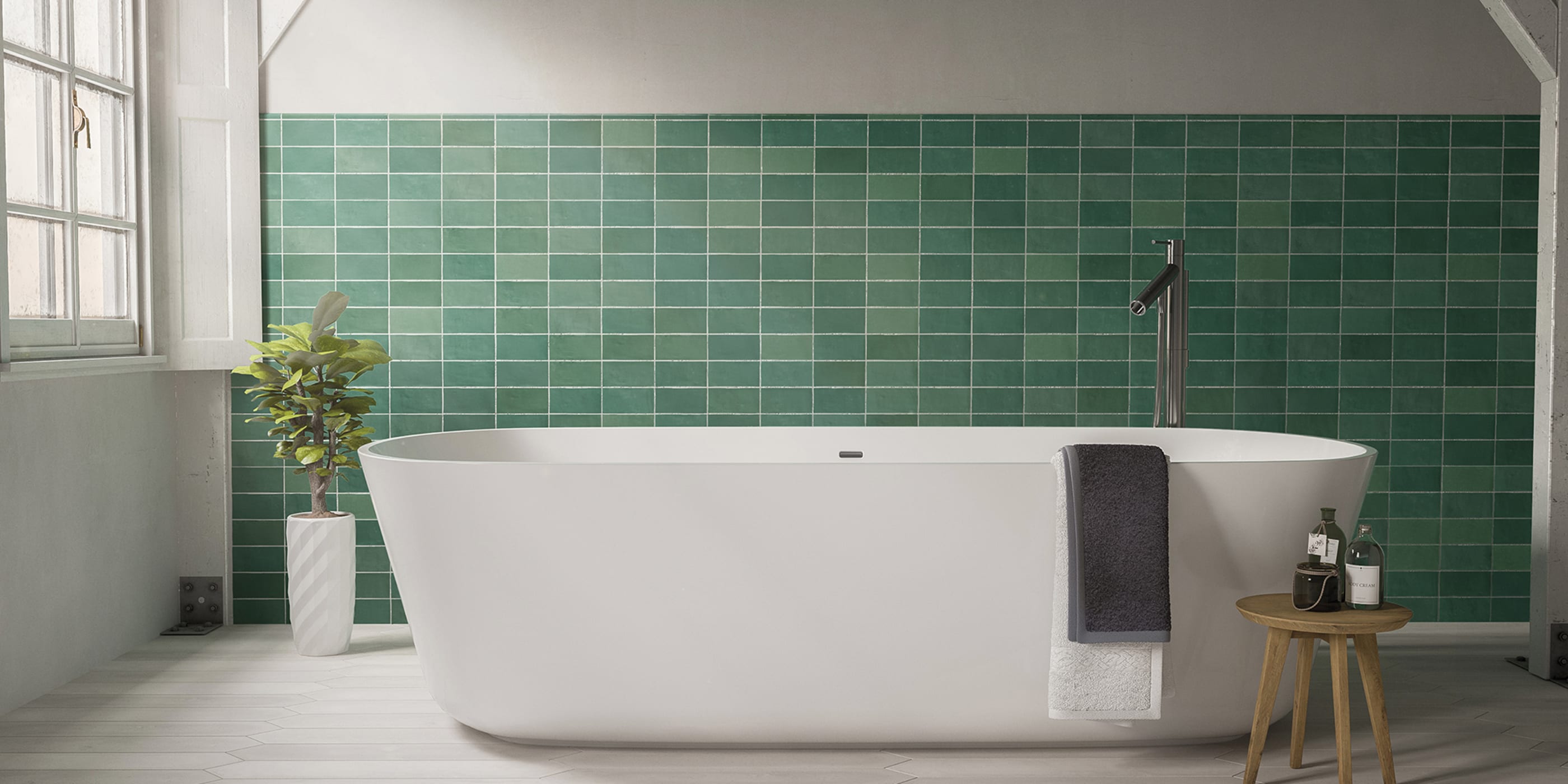 Modern kitchen backsplash with white marble mosaic tile and brushed brass faucet