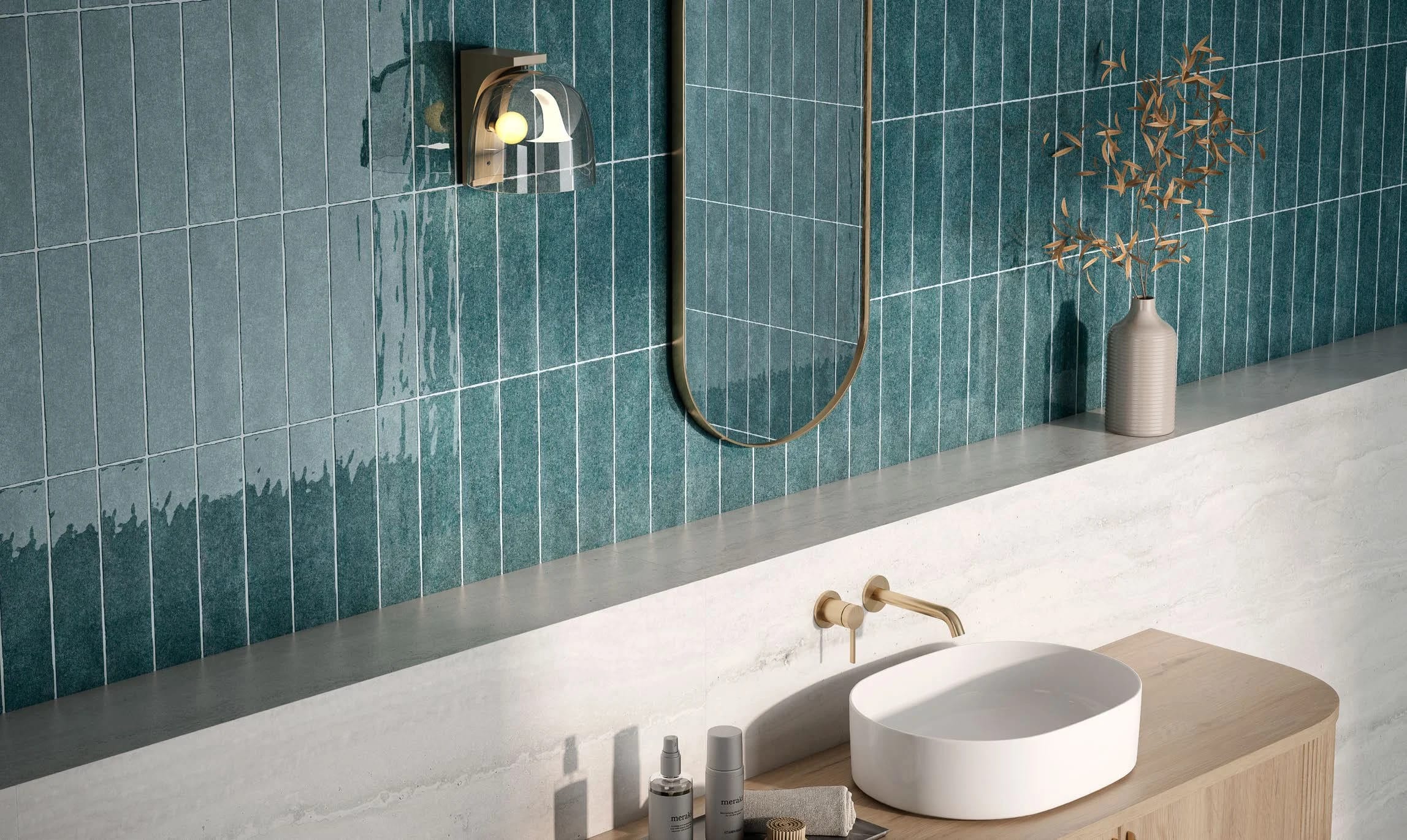 Harmoney indigo blue backsplash tile in bathroom with a brass mirror