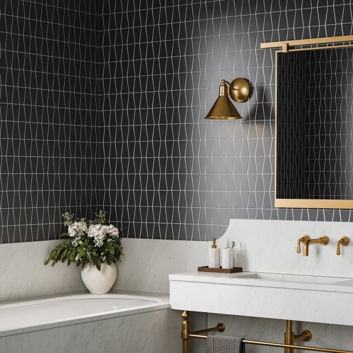Black, gold, and white bathroom with trapezoid backsplash and wall tile