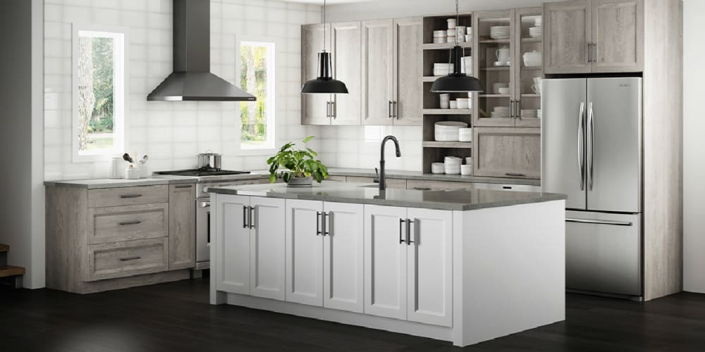 Transitional kitchen with a mix of grays, white cabinets, dark flooring, and gray countertops
