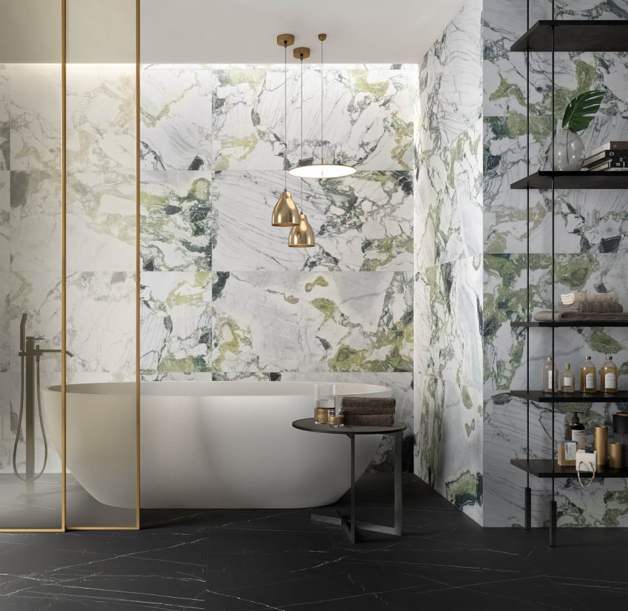 Bathroom with large luxury format wall tile with natural looks veining with grays and greens