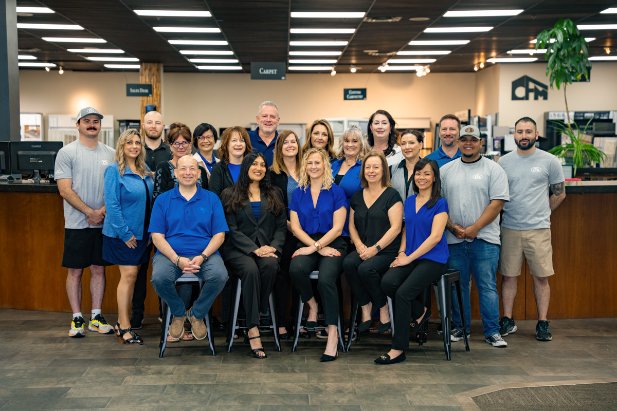 CFM showroom team members helping customers in a bright showroom