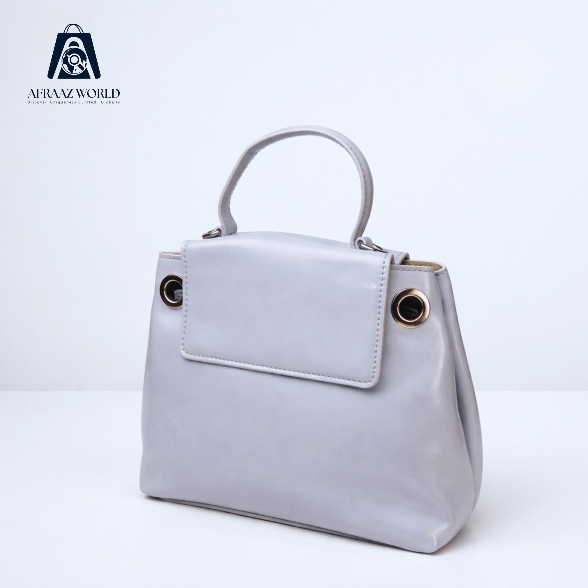 High-Shine Minimalist Handbag with Industrial Eyelet Accents