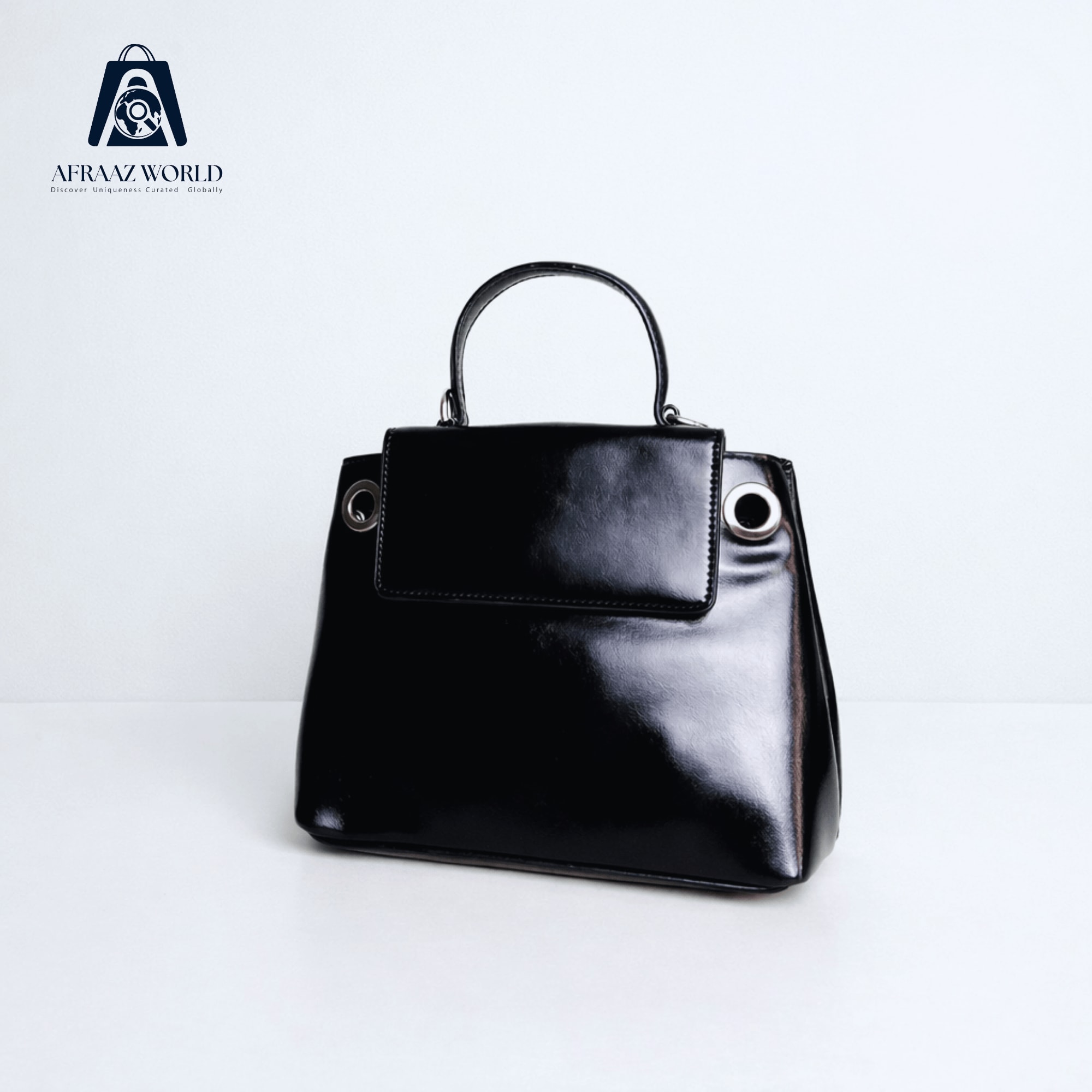 High-Shine Minimalist Handbag with Industrial Eyelet Accents