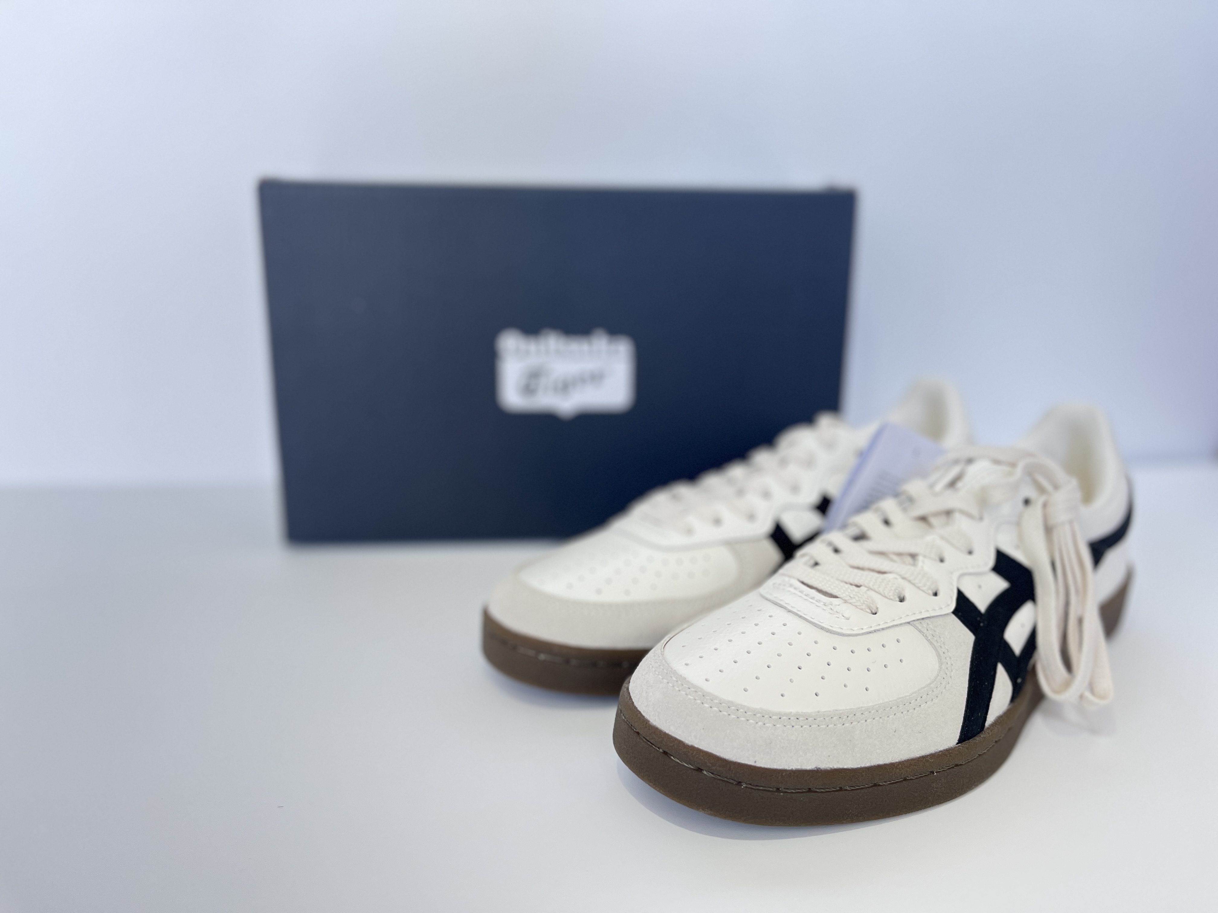 Onitsuka Tiger GSM Cream/Black top-down view showing lacing and tongue branding