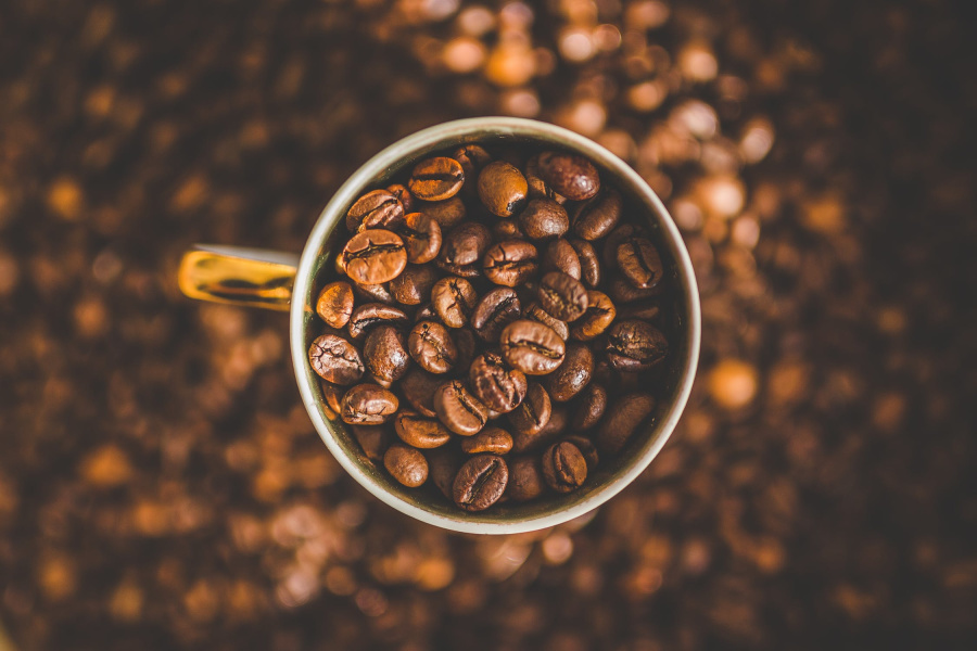Caffeine is an ingredient you should have in your eye cream Coffee beans in a cup