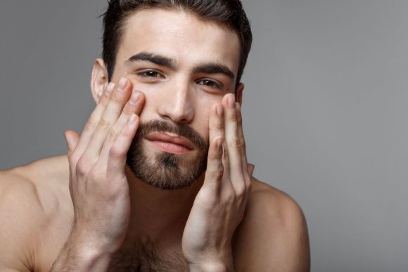 Man touching face