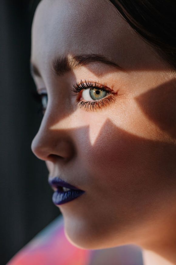Woman with star light on her eye