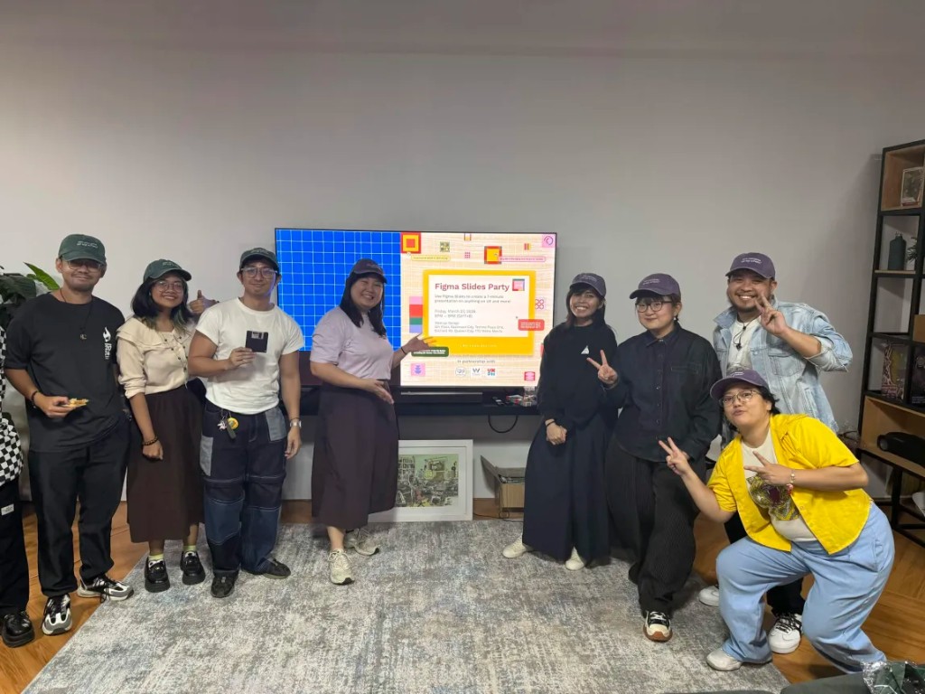 Group photo from Friends of Figma Slides Party in front of the screen