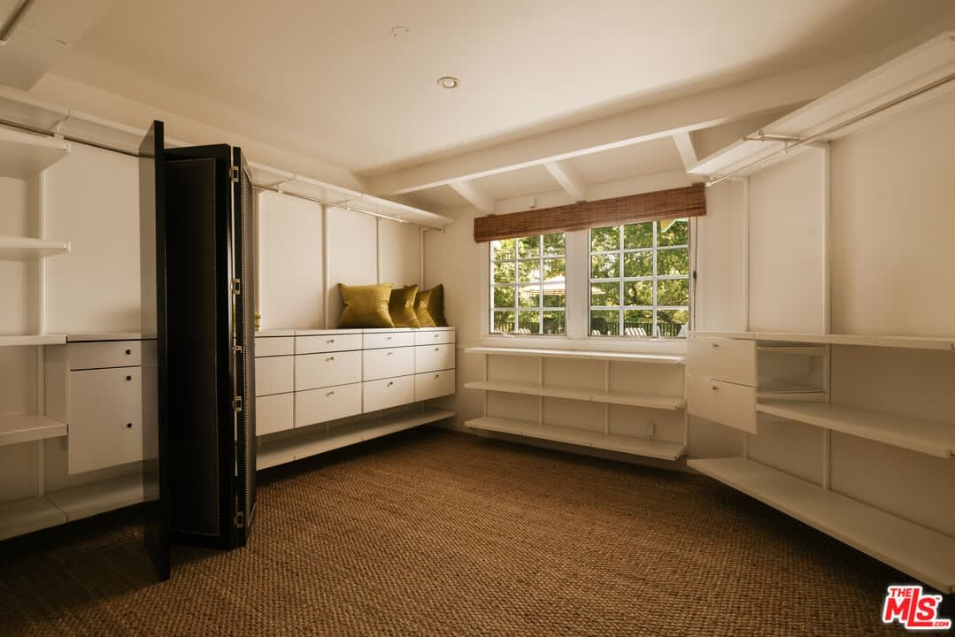 Walk-in closet with built-in shelving, 16822 Escalon Dr
