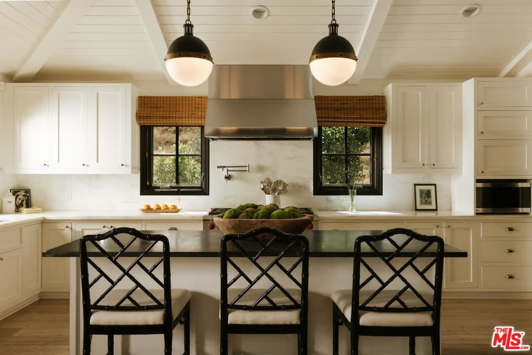 Kitchen island with range hood and pendants, 16822 Escalon Dr