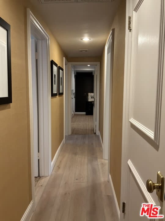 Hallway with light hardwood flooring, 16822 Escalon Dr