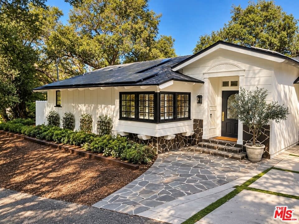 Front exterior with flagstone walkway, 16822 Escalon Dr