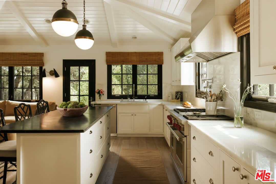 Kitchen with dark island and range, 16822 Escalon Dr