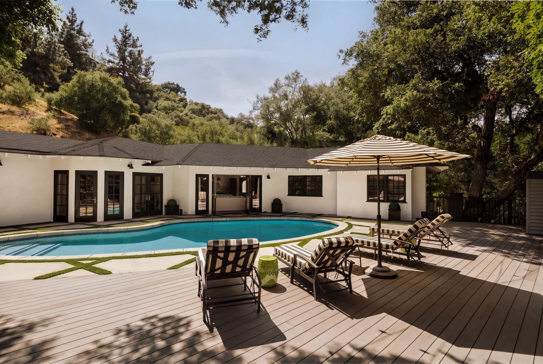 Backyard pool with umbrella and wood deck, 16822 Escalon Dr