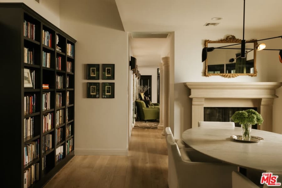 Dining area with built-in bookshelves and fireplace, 16822 Escalon Dr