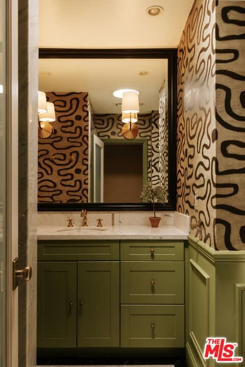 Powder room with green vanity, 16822 Escalon Dr