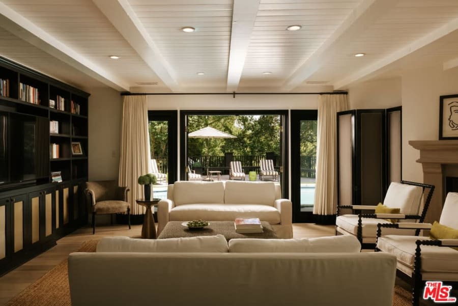 Living room with built-in bookshelves, 16822 Escalon Dr
