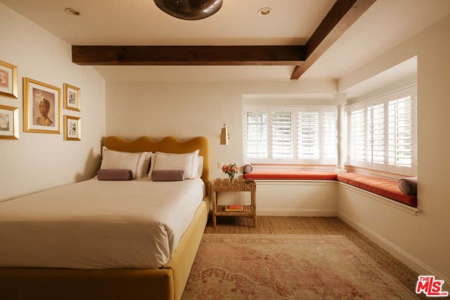 Bedroom with upholstered bed and bay window, 16822 Escalon Dr