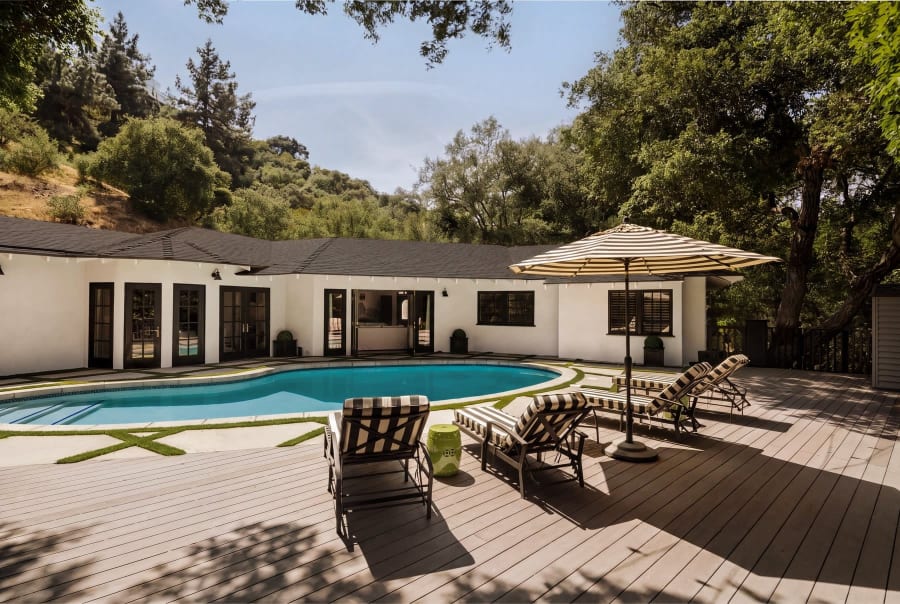 Backyard pool with umbrella and wood deck, 16822 Escalon Dr
