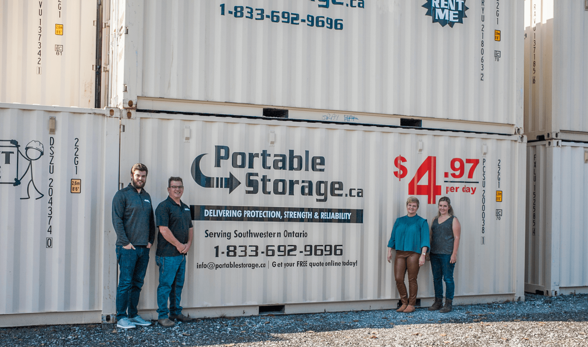 owners standing in front of shipping containers