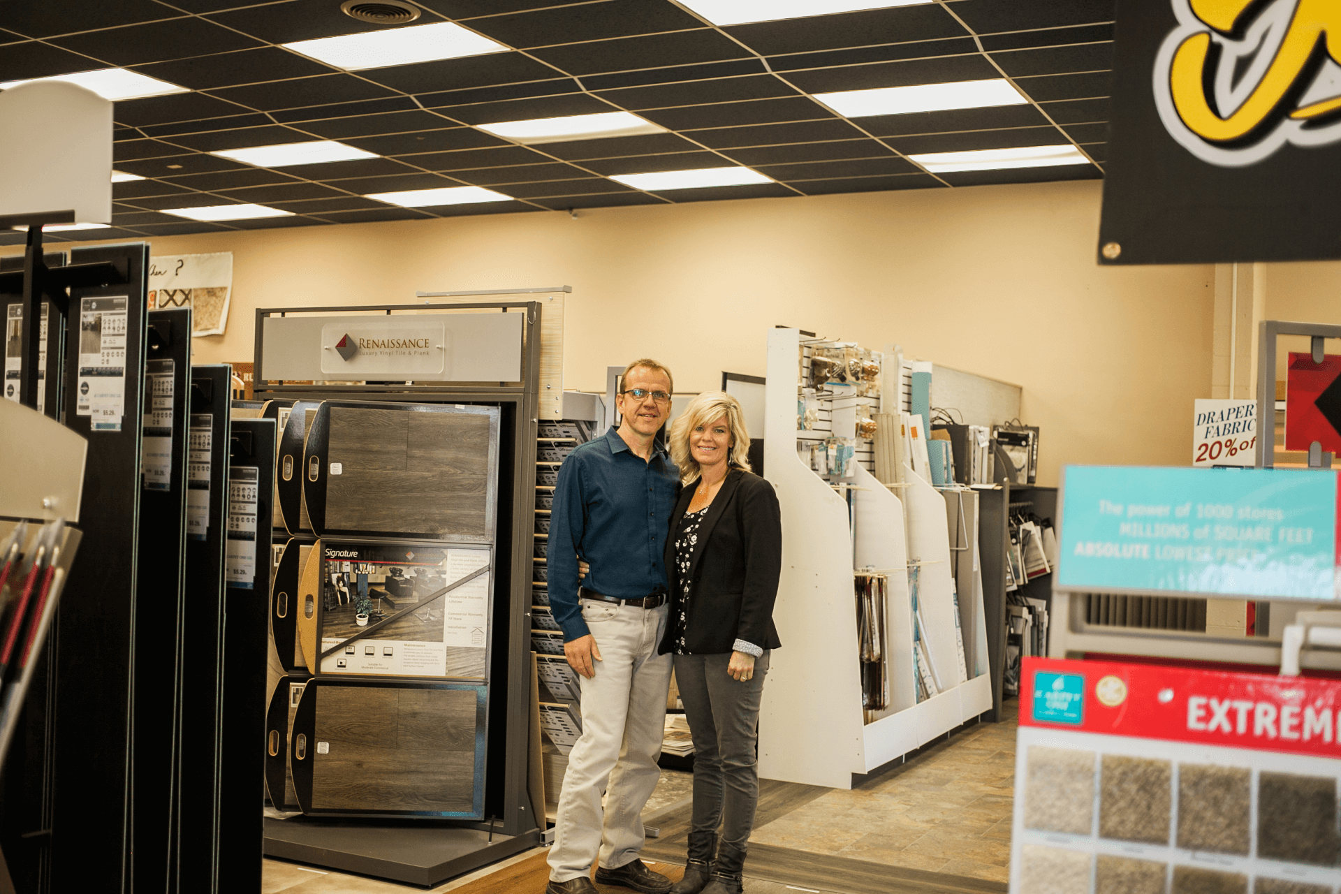 owners standing near carpet samples