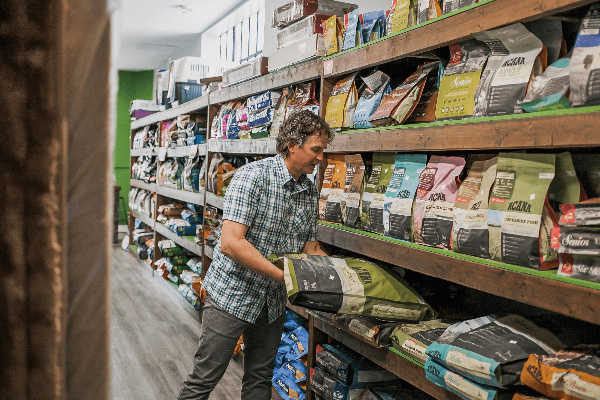 owner lifting dog food