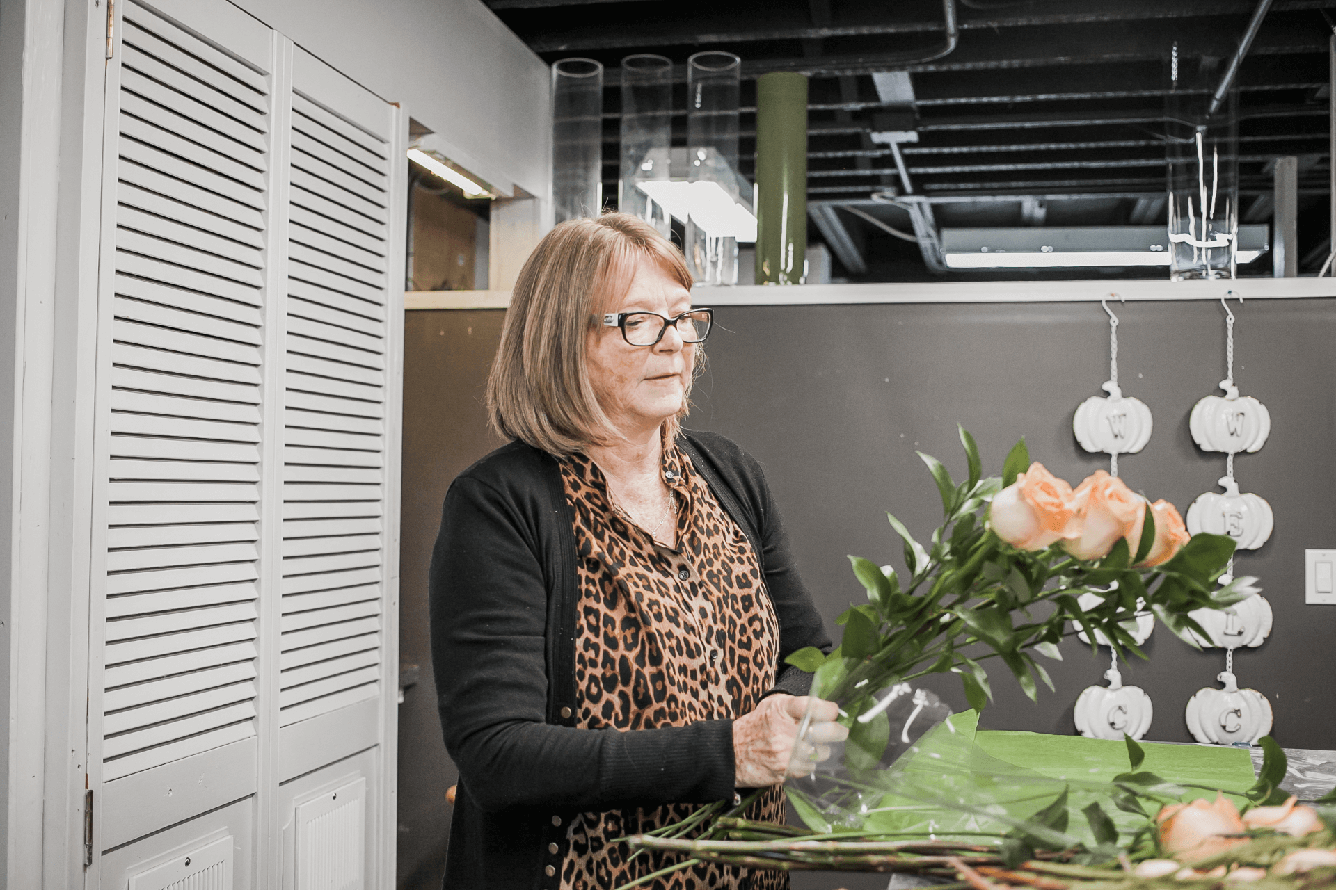 owner working on floral arrangement