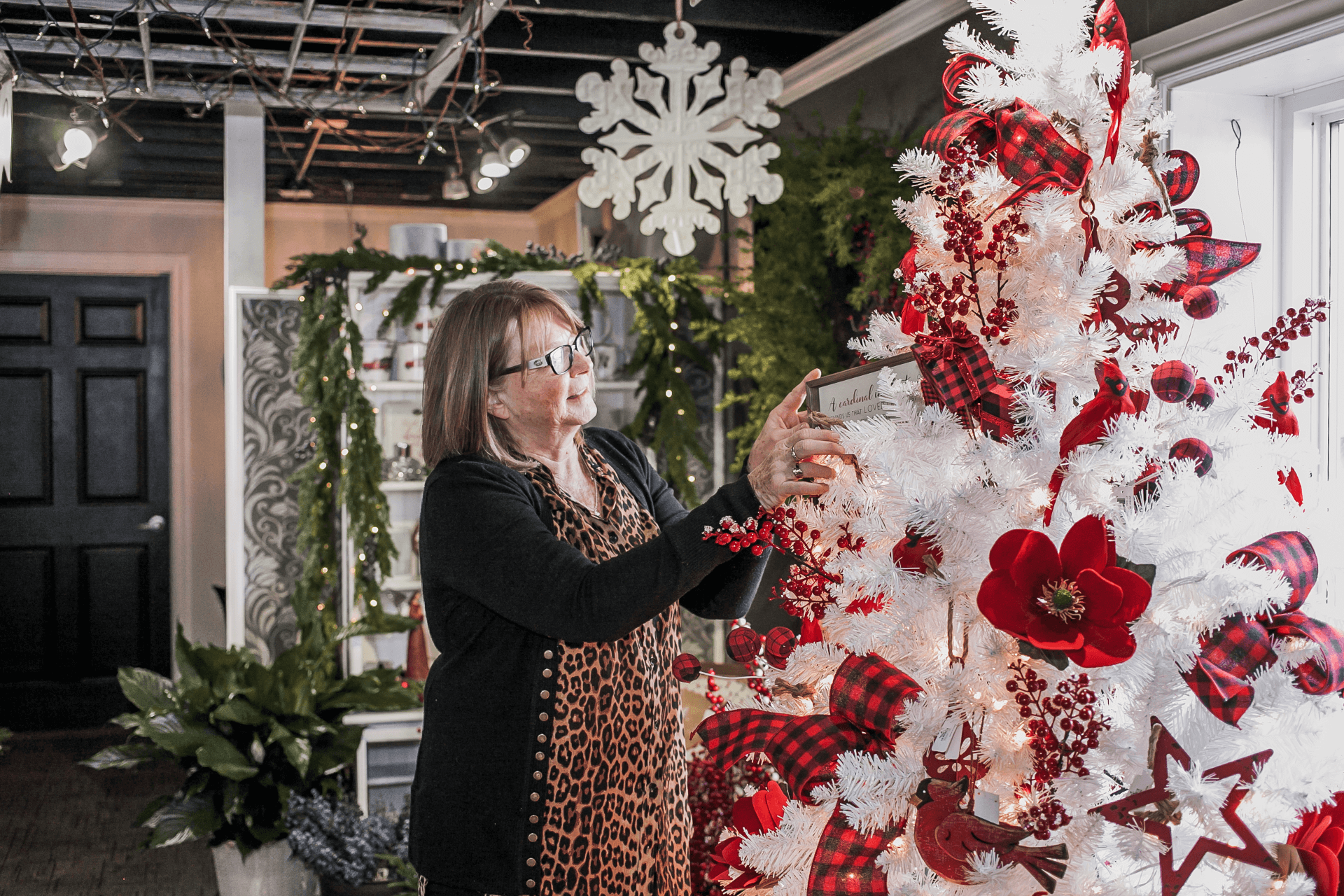 owner decorating flower shop