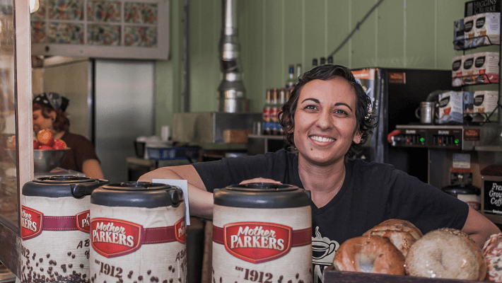 cafe owner behind counter