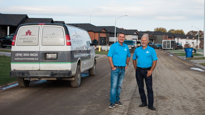 owners standing near their new builds