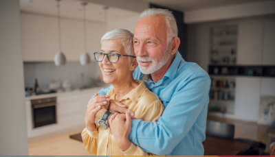 elderly couple smiling at each other