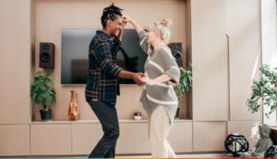 A couple dancing in living room